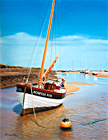 An oil painting of Norfolk Rose moored at Wells-next-the-Sea, Norfolk by Margaret Heath.